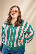 Pink and cream striped Palm of My Heart Cardigan with embroidered patch and front pockets, cozy and polished fit