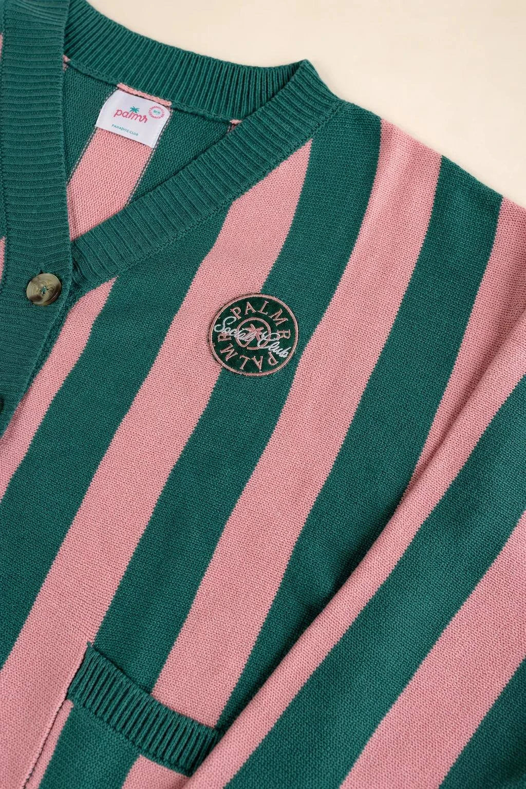 The Palm of My Heart Cardigan in pink and cream stripes with embroidered patch and front pockets, cozy and polished knitwear.