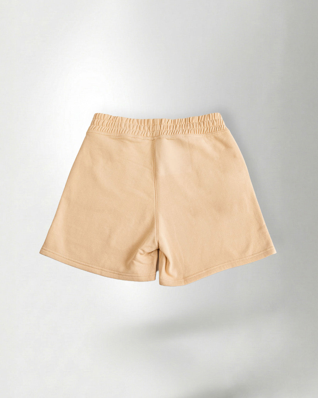 Light Beige "Palmr" shorts over a gray background