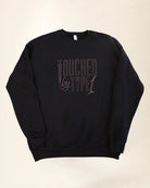 Black sweatshirt with 3d stylized embroidery lettering that says 'Touched By Type 1'