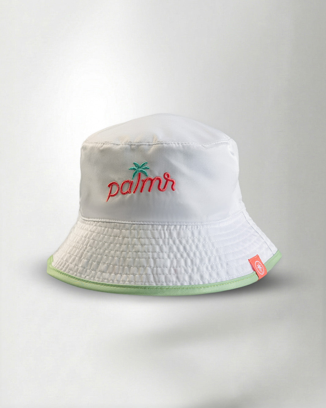 White bucket hat with a "Palmr" logo in embroidery
