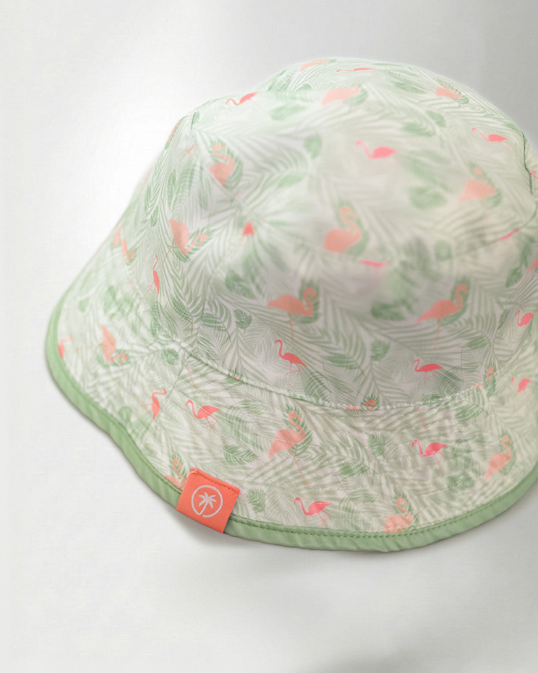 White bucket hat with a color tropical pattern.