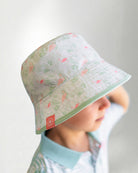 White bucket hat with a color tropical pattern.