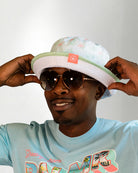 White bucket hat with a color tropical pattern.