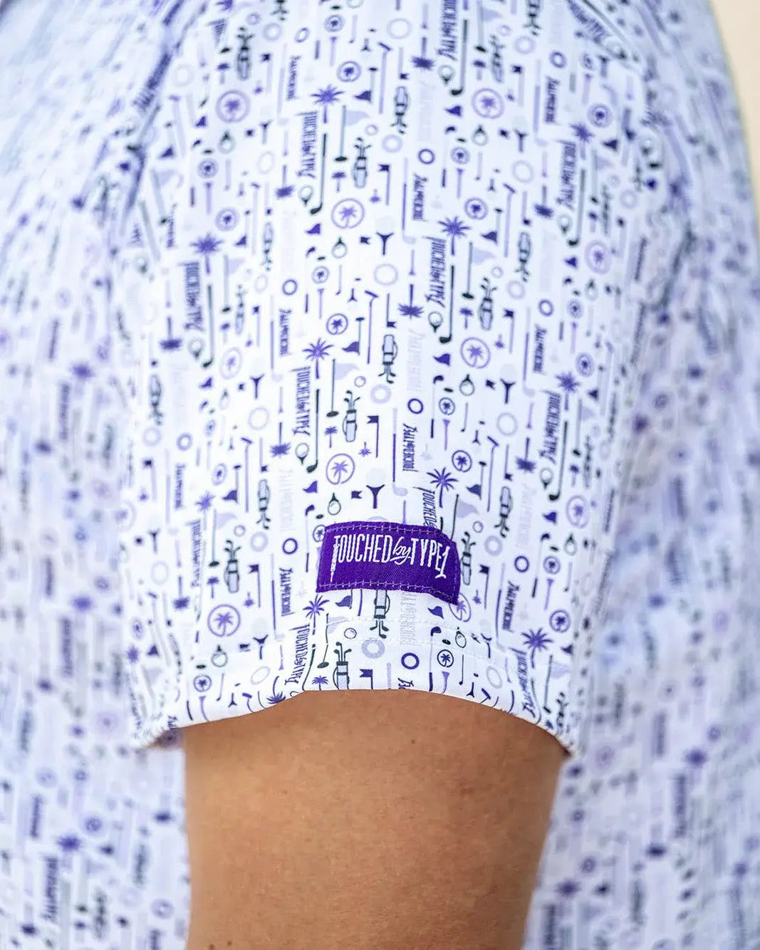 Man wearing a touched a Type One polo shirt