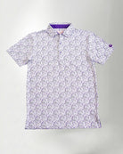 Man wearing a patterned shirt and cap against a plain background