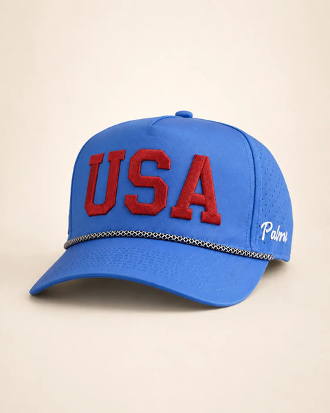 The USA Signature Hat (Limited): royal blue rope snapback, USA embroidered in red on the front, black and white braided rope, perforated sides.