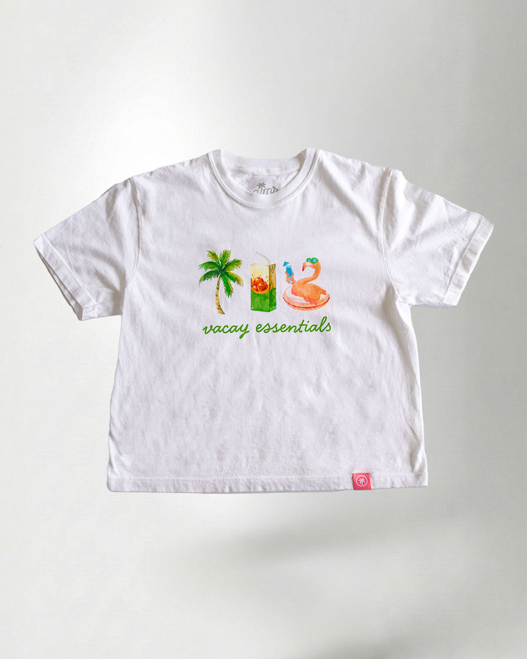 White tee showcasing a "Palmr" branding with vacay essentials objects.
