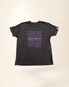 Black t-shirt with purple text on a beige background