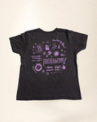 Black t-shirt with purple graphic design on a beige background