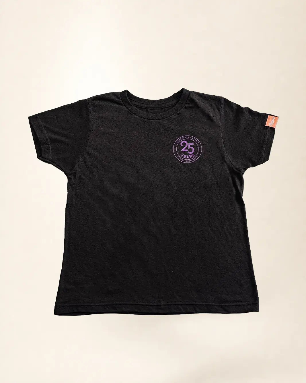 Black t-shirt with a purple logo on a beige background