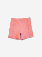 Pink shorts on a light purple background