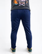 Person wearing navy blue pants on a white background