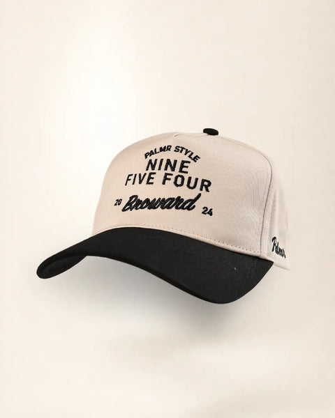 The Nine Five Four Broward Heritage Hat (Black): cream and black two-tone heritage cap with NINE FIVE FOUR over 20 Broward 24 embroidered in black.