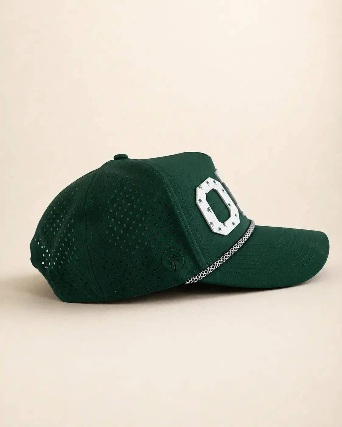 Green ORL 407 hat with raised white silicone letters and palm designs, water-resistant and structured rope front