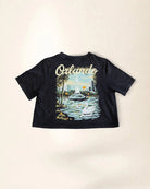 Black crop t-shirt showcasing Orlando's Owala's lake illustration