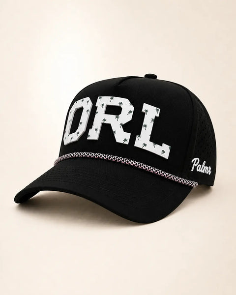 The ORL Signature Hat (Black): black rope snapback with ORL in white palm-print letters, pink and white rope, perforated sides, Palmr script.