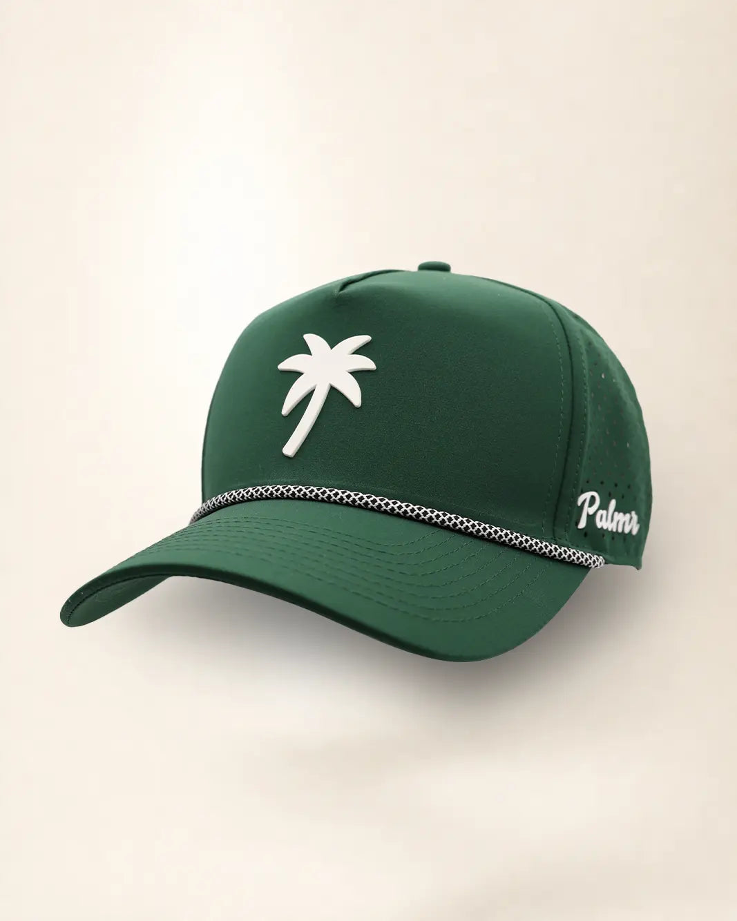 The Palm Icon Signature Hat (Green), three-quarter view: white raised palm tree icon on a dark green rope snapback, braided rope, white Palmr script.