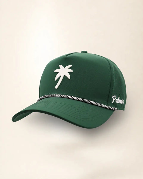 The Palm Icon Signature Hat (Green), three-quarter view: white raised palm tree icon on a dark green rope snapback, braided rope, white Palmr script.