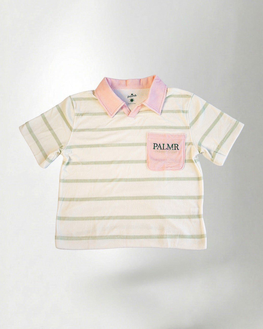 A striped shirt and shorts with a visible brand logo on a white background