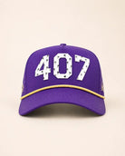 Purple and gold The 407 Hat with white Orlando area code and small palm logo on side