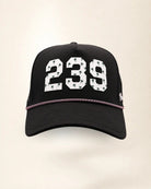 The 239 Signature Hat (Black), front view: white raised 239 with small palm print on a black crown, pink and white rope along the brim.