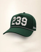 The 239 Signature Hat (Green), three-quarter view: white raised 239 with small palm print on a green rope snapback, black and white rope, white Palmr script.