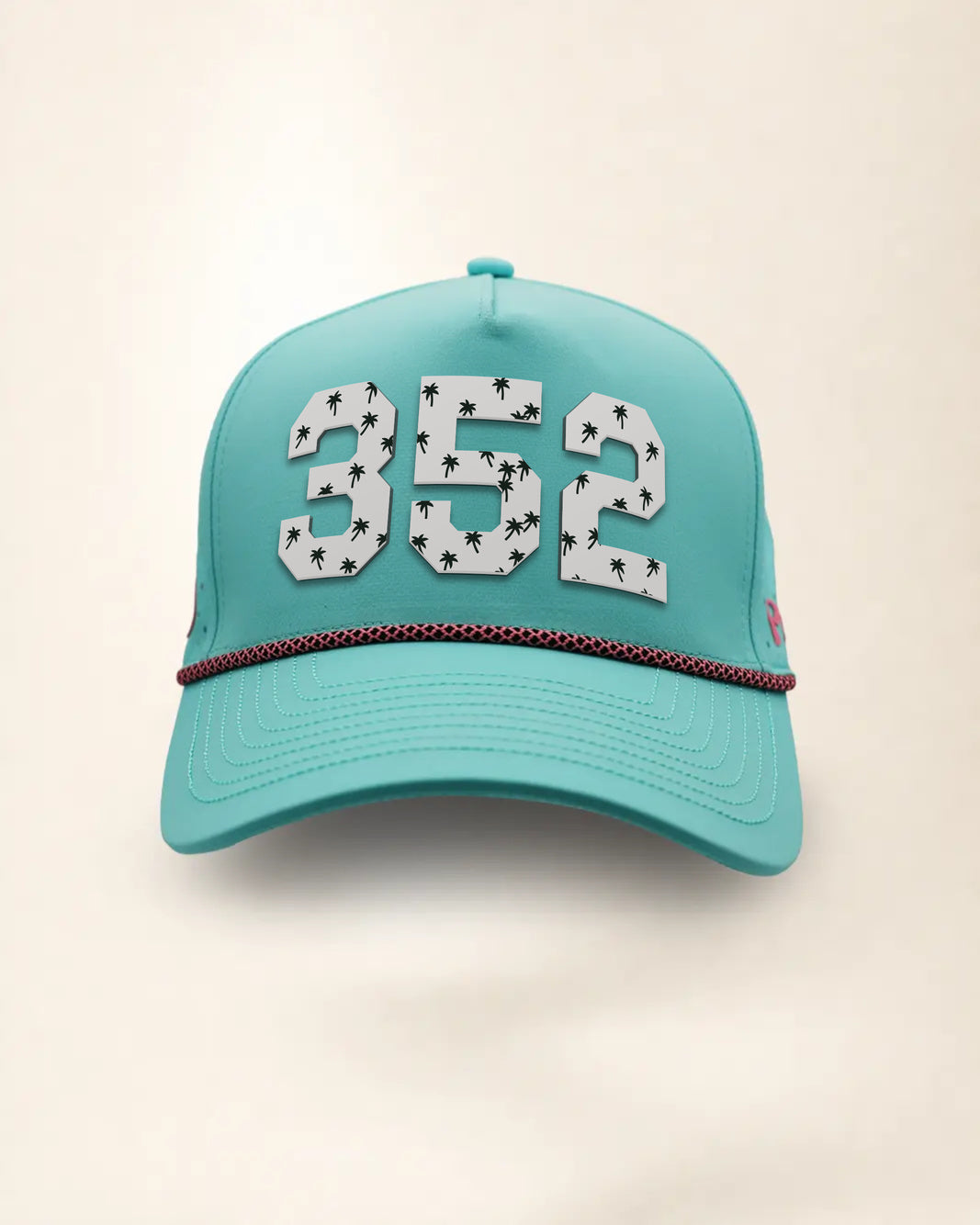 The 352 Signature Hat (Teal), front view: white raised 352 with small palm print on a teal crown, pink and black rope along the brim.