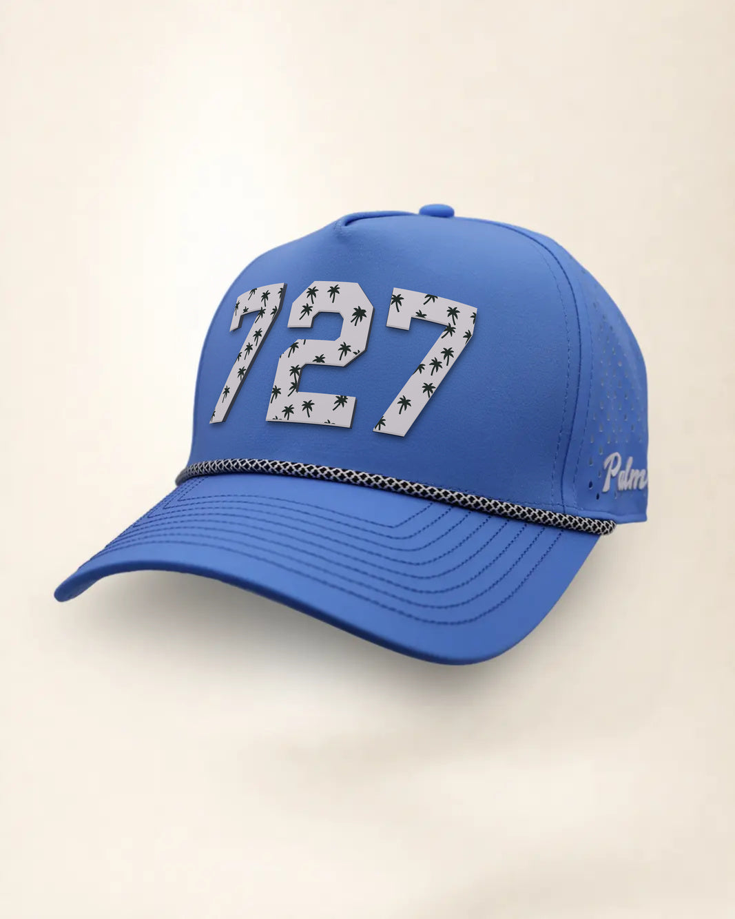 The 727 Signature Hat (Blue), three-quarter view: white raised 727 with small palm print on a blue rope snapback, black and white rope, white Palmr script.