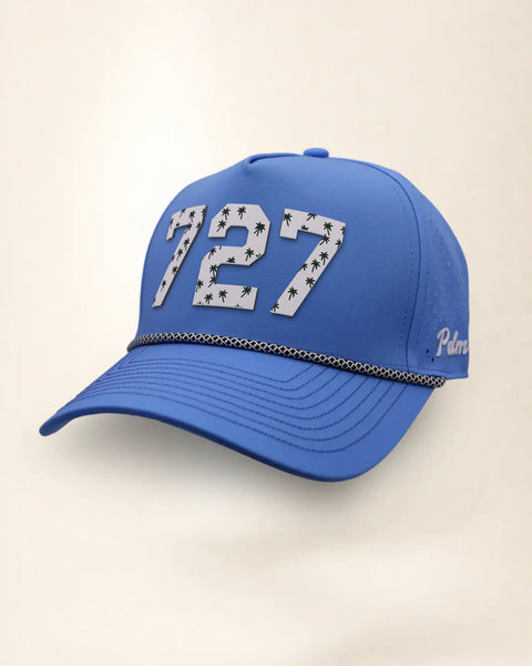 The 727 Signature Hat (Blue), three-quarter view: white raised 727 with small palm print on a blue rope snapback, black and white rope, white Palmr script.