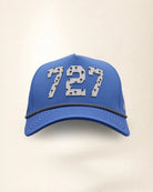 The 727 Signature Hat (Blue), front view: white raised 727 with small palm print on a blue crown, black and white rope along the brim.