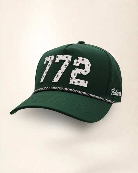 The 772 Signature Hat (Green), three-quarter view: white raised 772 with small palm print on a green rope snapback, black and white rope, white Palmr script.