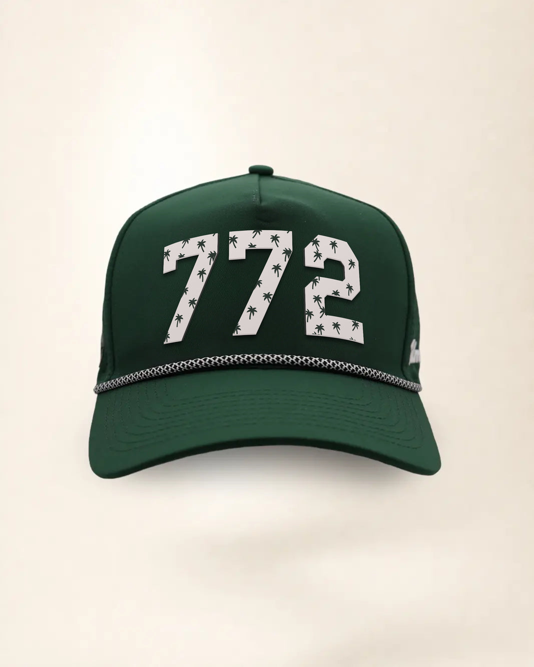 The 772 Signature Hat (Green), front view: white raised 772 with small palm print on a green crown, black and white rope along the brim.