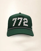 The 772 Signature Hat (Green), front view: white raised 772 with small palm print on a green crown, black and white rope along the brim.