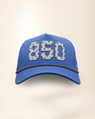 The 850 Signature Hat (Blue), front view: white raised 850 with small palm print on a blue crown, black and white rope along the brim.