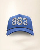 The 863 Signature Hat (Blue), front view: white raised 863 with small palm print on a blue crown, black and white rope along the brim.