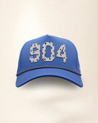 The 904 Signature Hat (Blue), front view: white raised 904 with small palm print on a blue crown, black and white rope along the brim.