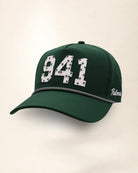 The 941 Signature Hat (Green), three-quarter view: white raised 941 with small palm print on a green rope snapback, black and white rope, white Palmr script.