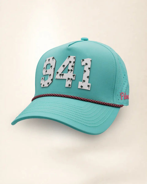 The 941 Signature Hat (Teal), three-quarter view: white raised 941 with small palm print on a teal rope snapback, pink and black rope, pink Palmr script.